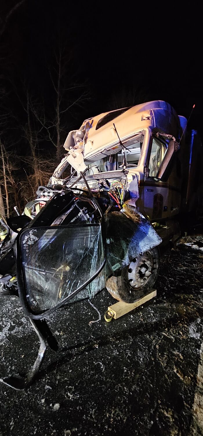 Severely damaged truck after a nighttime crash, illustrating real stories of people who escaped death by pure luck.