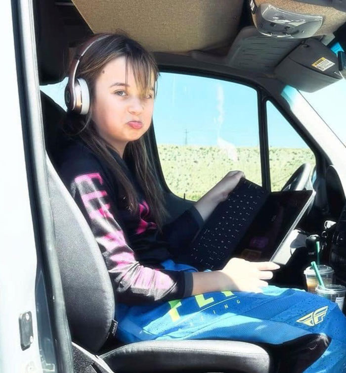 Young woman wearing headphones sitting inside a vehicle, unrelated to Channing Tatum age gap controversies. Young woman wearing headphones sitting inside a vehicle, unrelated to Channing Tatum age gap controversies.