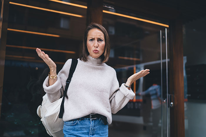 Confused woman standing at doorstep, showing frustration after being denied entry at ex-DIL’s house unannounced. Confused woman standing at doorstep, showing frustration after being denied entry at ex-DIL’s house unannounced.