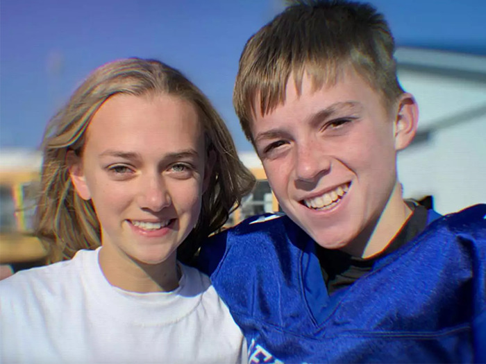 Two teenagers smiling outdoors, illustrating a mom who catfished her own daughter using nickname Lo in threats.