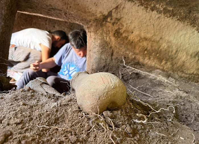 Archeologists examining ancient 5,000-year-old fairy houses and artifacts on the Italian island of Sardinia. Archeologists examining ancient 5,000-year-old fairy houses and artifacts on the Italian island of Sardinia.
