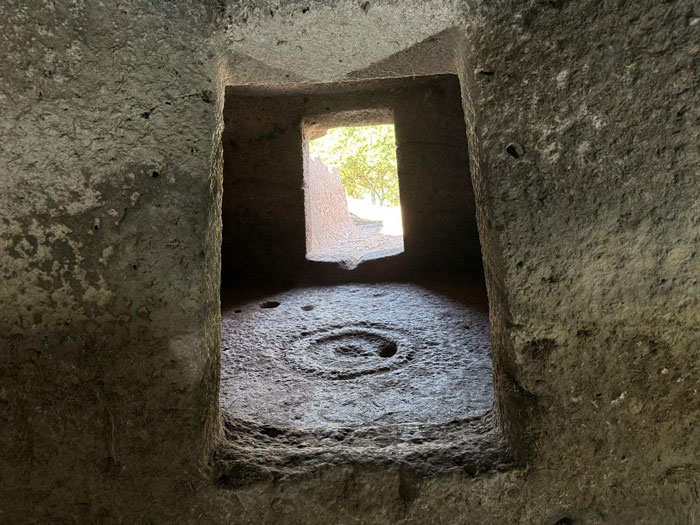 Ancient stone interior with spiral carving inside a 5,000-year-old fairy house on the Italian island of Sardinia. Ancient stone interior with spiral carving inside a 5,000-year-old fairy house on the Italian island of Sardinia.