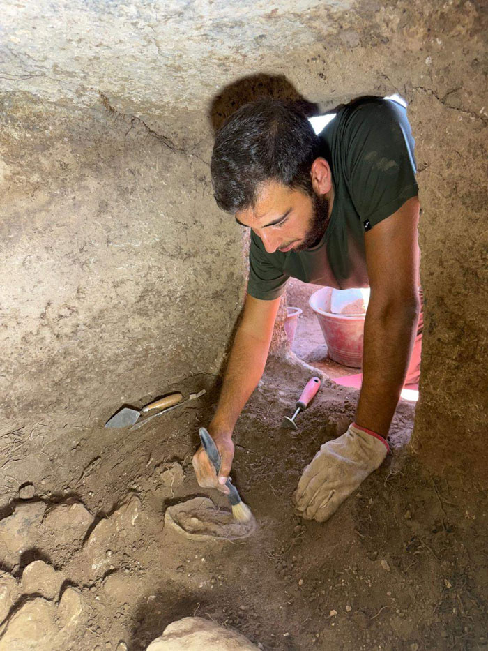 Archaeologist carefully excavating one of the 5,000-year-old fairy houses on the Italian island of Sardinia. Archaeologist carefully excavating one of the 5,000-year-old fairy houses on the Italian island of Sardinia.