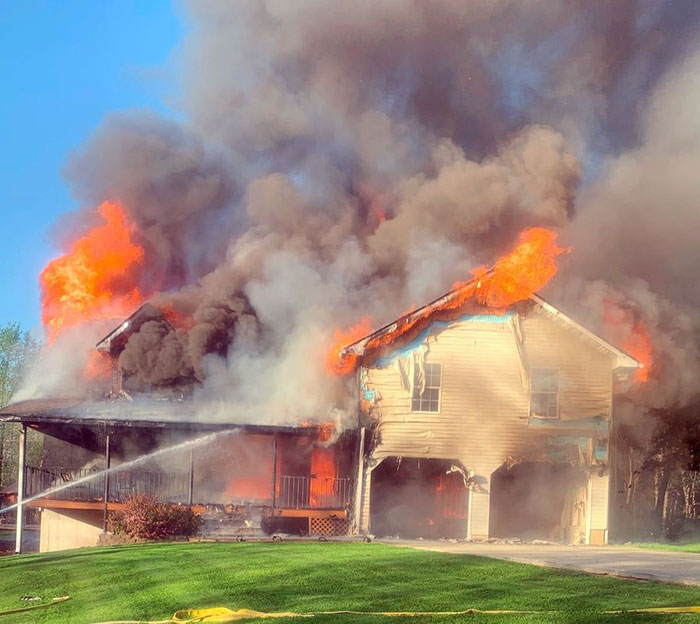 House engulfed in flames with thick smoke rising, symbolizing the woman who tanked boyfriend’s career after Charlie Kirk comments. House engulfed in flames with thick smoke rising, symbolizing the woman who tanked boyfriend’s career after Charlie Kirk comments.