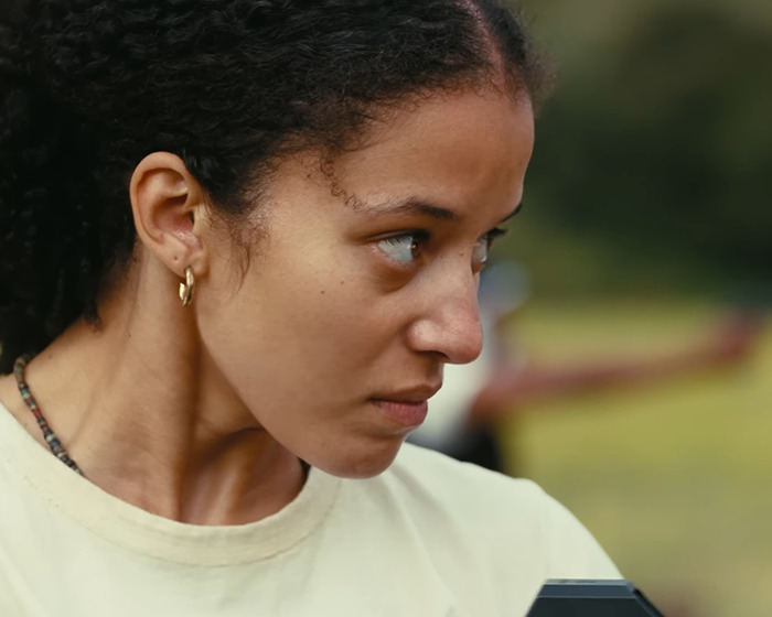 Close-up of Chase Infiniti looking serious outdoors, capturing fans praise for her response to reporter&rsquo;s creepy question.