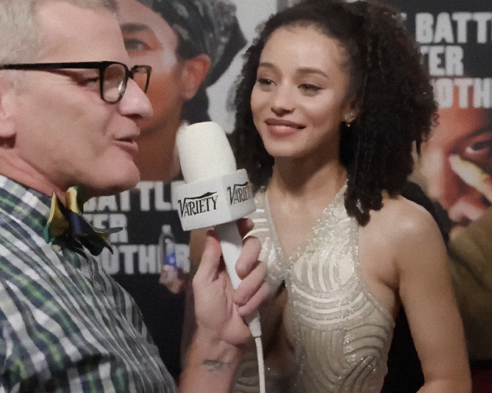 Chase Infiniti answering a reporter&rsquo;s question in an interview at a red carpet event, fans praising his response.