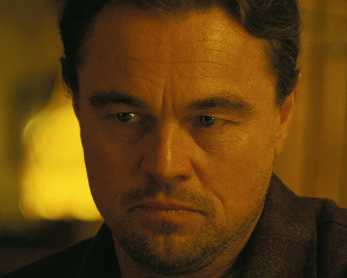 Close-up of Leonardo DiCaprio with a serious expression, relating to fans praising Chase Infiniti's response to reporter.