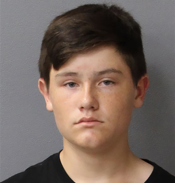 Teen boy with short brown hair and neutral expression, related to two mothers applauded for turning in their children to police.