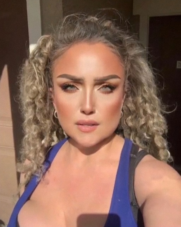 Flight attendant with curly hair in sunlight, connected to a shocking arrest and mysterious disappearance case.