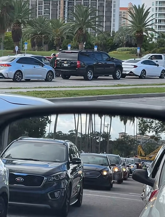 Cars lined up at a food bank parking lot highlighting the USA richest poor people debate and public reaction.