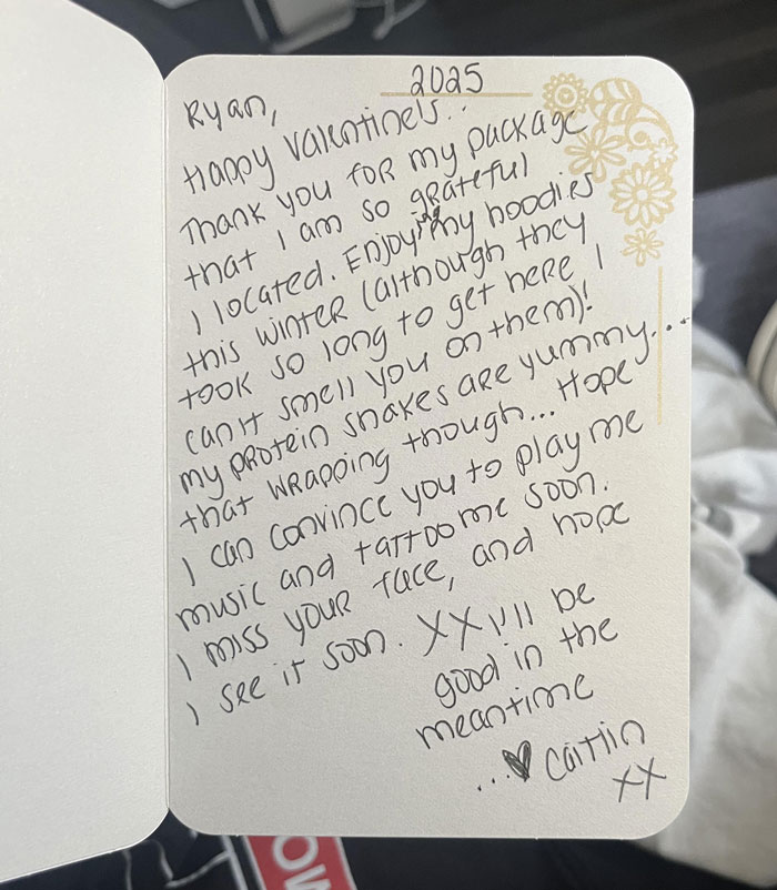 Handwritten Valentine card with a personal message, featuring a floral border and casual handwriting style.