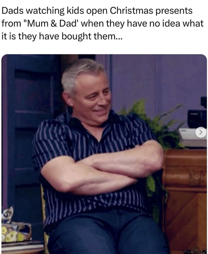 Man with arms crossed smiling awkwardly, representing men humor in a relatable family moment meme.