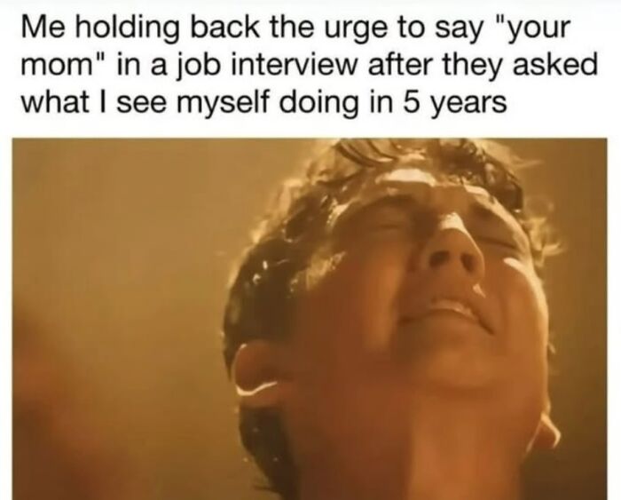 Man holding back urge to say "your mom" during job interview, showing relatable men humor meme about coping strategies.