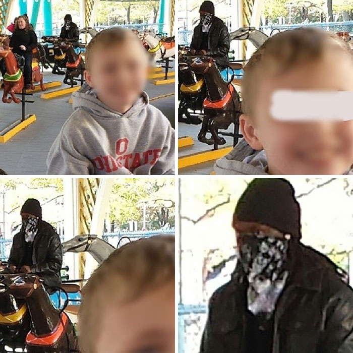 Boy wearing gray Ohio State hoodie on a carousel ride with a person in a black jacket and bandana mask at amusement park.
