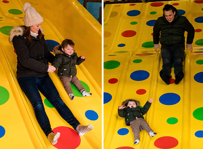Mom and dad sliding with toddler on colorful playground slide showing funny differences between parents and kids.