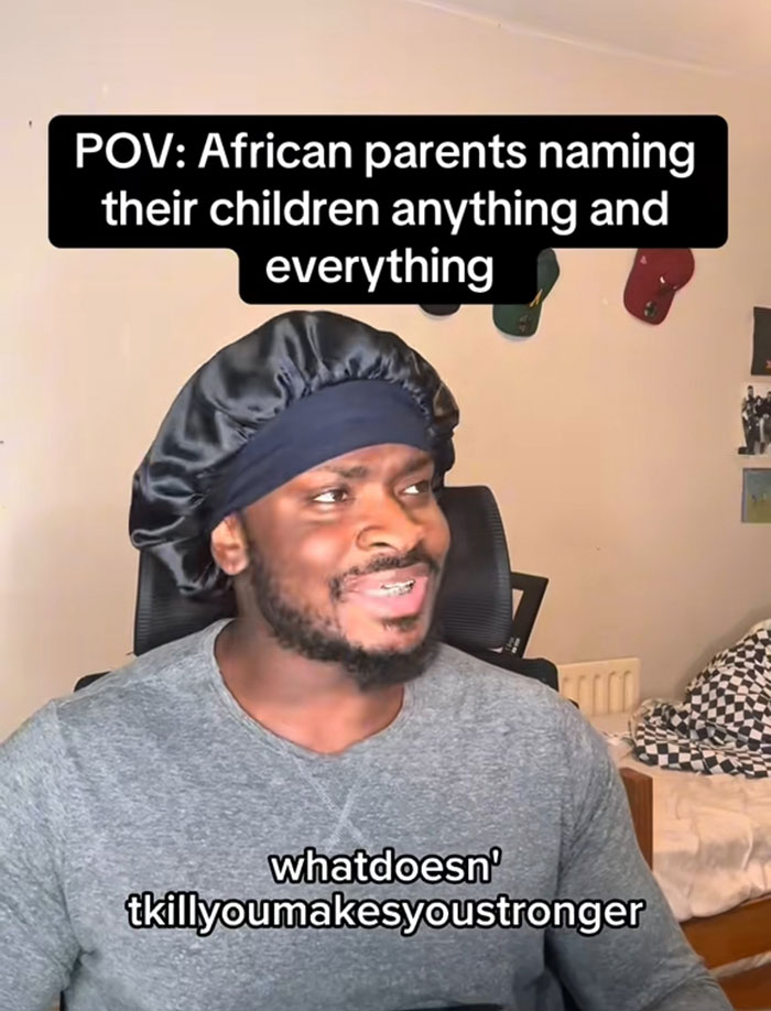 Man wearing a black bonnet, smiling and reacting to unusual African names with strengthtofightanotherday theme in a casual room setting Man wearing a black bonnet, smiling and reacting to unusual African names with strengthtofightanotherday theme in a casual room setting