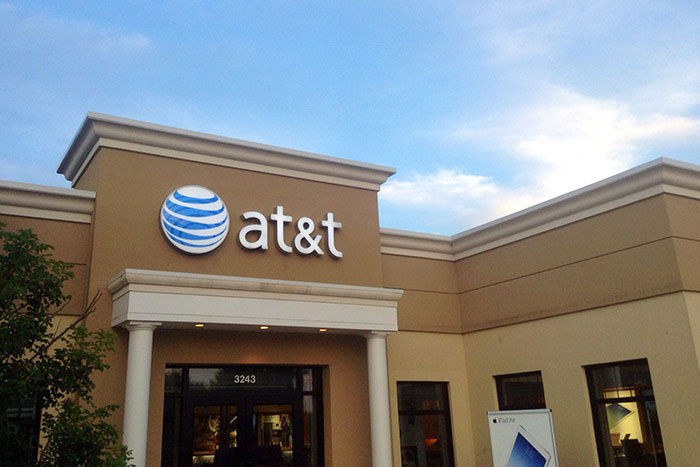 AT&T store exterior with logo, illustrating technology challenges faced by older people online and in daily life.
