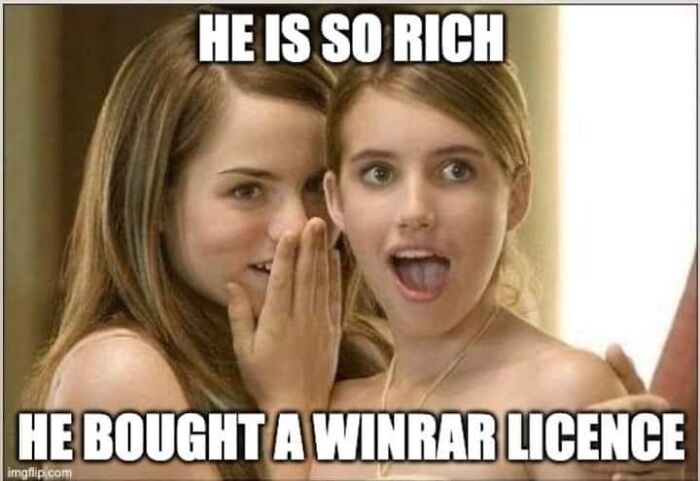 Two young women sharing a funny meme about programmers buying a WinRAR license when not coding.