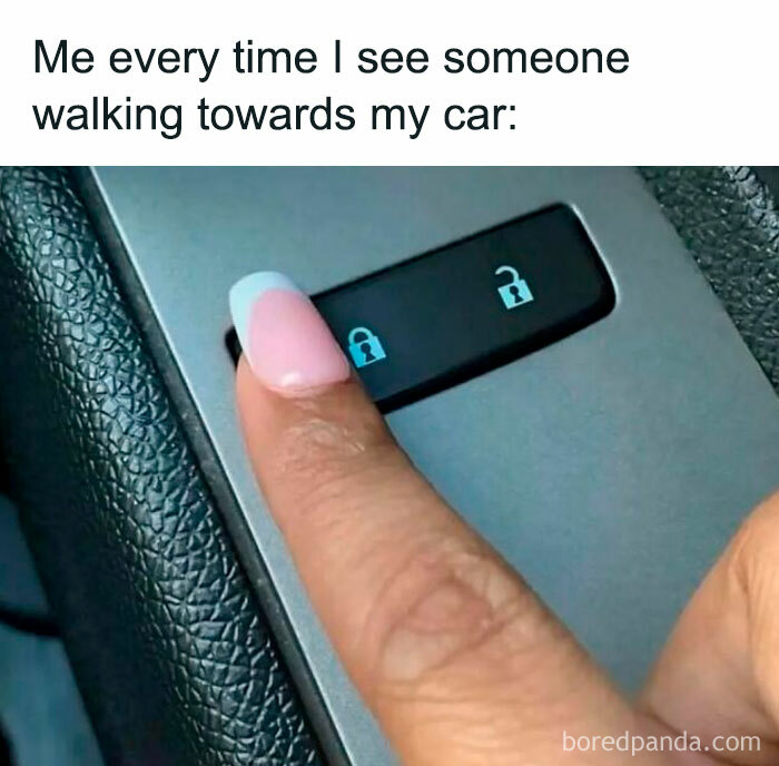 Finger with pink nail pressing car lock button, illustrating a hilarious meme about locking car for protection.