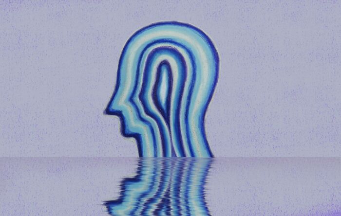 Abstract blue human profile illustration with layered profiles and a water reflection symbolizing trust your gut feeling and precognition.