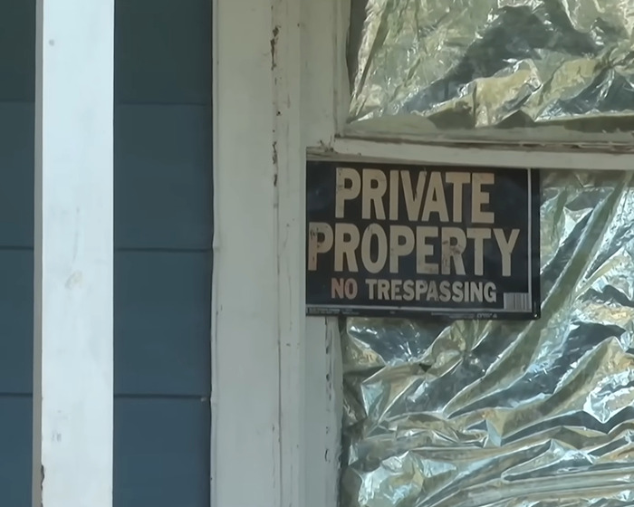 Private property sign posted on a door of a house linked to grandma arrested after 11YO girl allegedly gave birth case