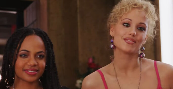 Two women seated indoors, representing characters from worst-best movies that people actually enjoy in film history.