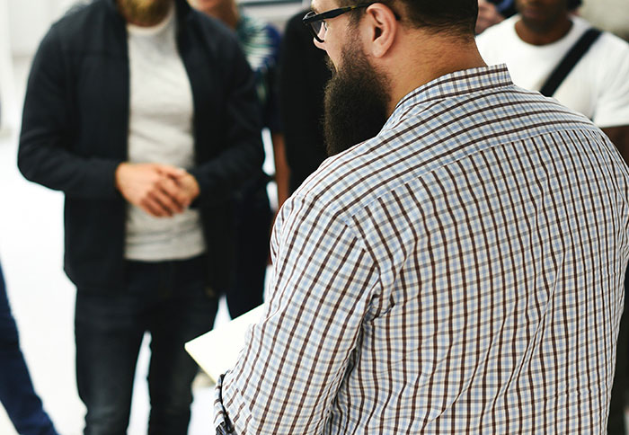 Group of people in casual attire having discussion, highlighting moments when listening to instincts proved crucial.