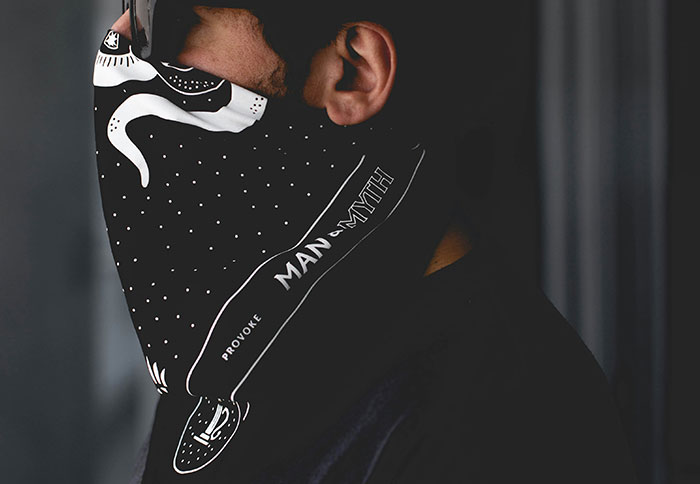 Person wearing a black bandana covering face, illustrating instinct and caution in potentially evil situations.