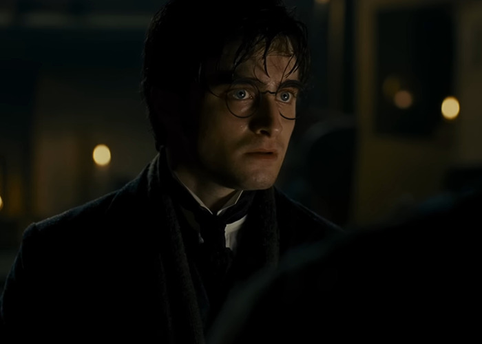Close-up of a man resembling Harry Potter in a dark room, promoting a Harry Potter And The Cursed Child fan-made trailer.