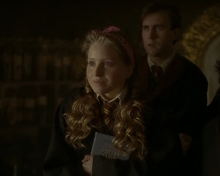 Harry Potter star in costume holding a potion book, breaking silence after ban from fan event for adult account.