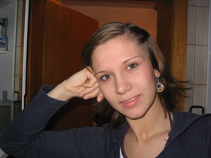 Young woman resting her head on her hand, representing chilling messages left before people went missing.