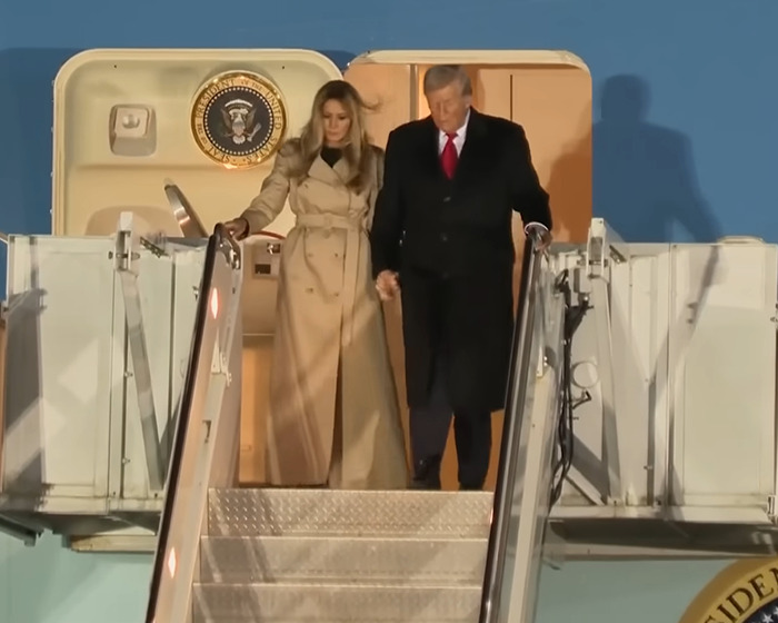 Melania Trump and Donald Trump descending airplane stairs highlighting Melania’s wardrobe choices during UK state visit. Melania Trump and Donald Trump descending airplane stairs highlighting Melania’s wardrobe choices during UK state visit.