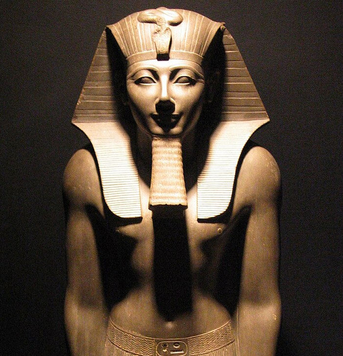 Stone statue of an ancient Egyptian pharaoh with headdress, representing a weird and iconic bruh moment in history.