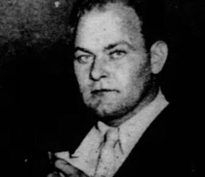 Black and white photo of a man in a suit, representing a weird and iconic bruh moment from history.