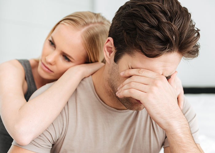 Husband and wife in emotional distress, highlighting intimacy boundaries and relationship struggles in a tense moment.