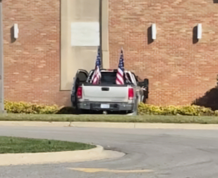 Pickup truck crashed into brick wall of Michigan church with American flags in the bed linked to conspiracy theorists discussion Pickup truck crashed into brick wall of Michigan church with American flags in the bed linked to conspiracy theorists discussion