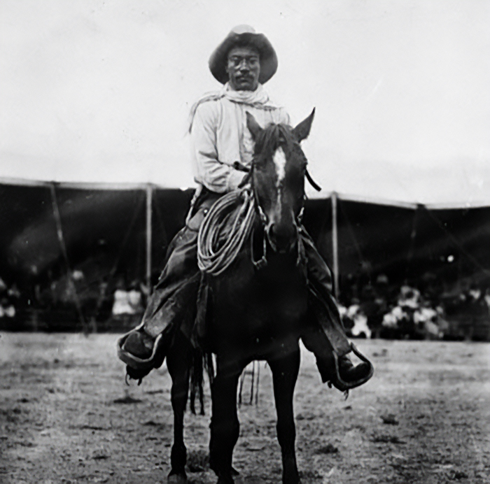 Black and white photo of a cowboy on horseback, related to famous people who have lost their lives in animal attacks.