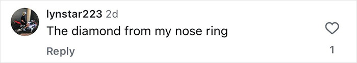 Screenshot of a social media comment showing a user sharing a photo of a diamond from a nose ring in an engagement post. Screenshot of a social media comment showing a user sharing a photo of a diamond from a nose ring in an engagement post.