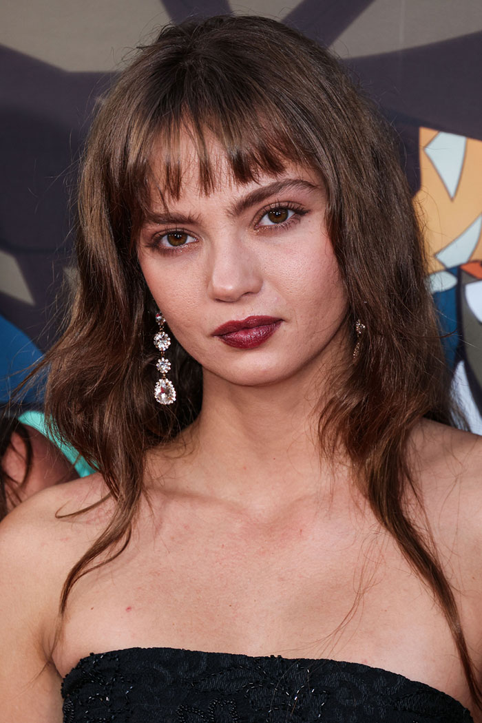Close-up of a woman with brown hair and dark lipstick, highlighting the age gap controversy involving Channing Tatum. Close-up of a woman with brown hair and dark lipstick, highlighting the age gap controversy involving Channing Tatum.