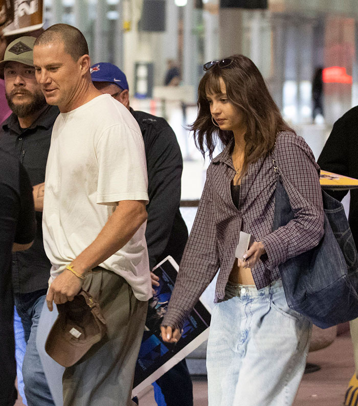 Channing Tatum and girlfriend walking outdoors amid age gap controversy during public debut with casual outfits. Channing Tatum and girlfriend walking outdoors amid age gap controversy during public debut with casual outfits.