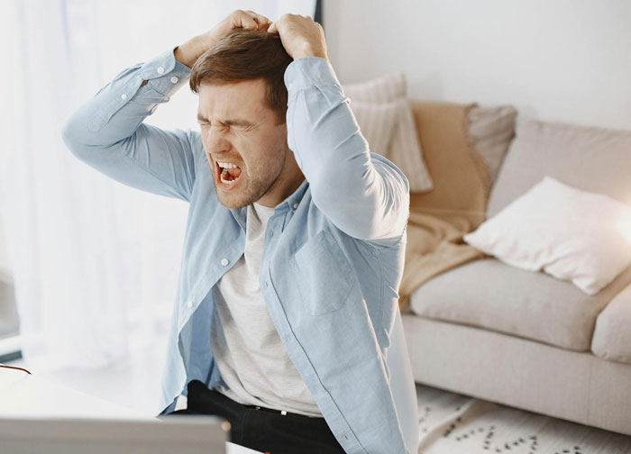 Frustrated man showing red flags after starting to earn more than girlfriend a year into the relationship at home.