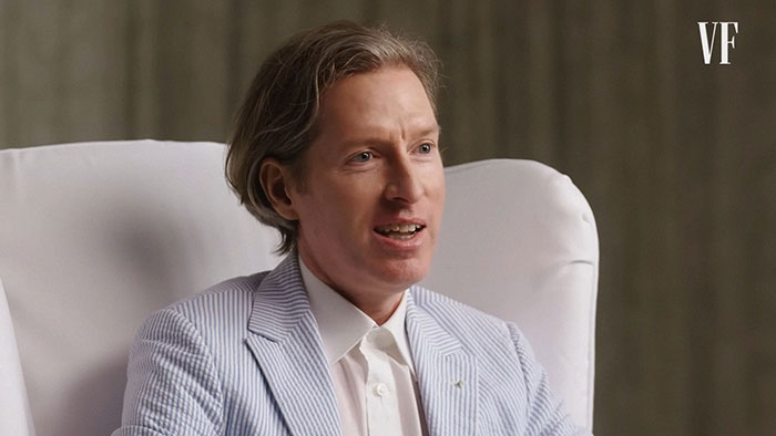 Man in a striped blazer and white shirt speaking in an interview setting, representing fascinating knowledge facts.
