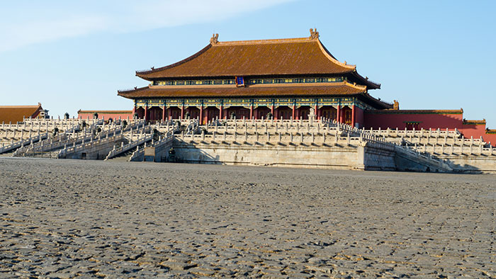 Historic Chinese palace with detailed stone railings under clear sky, illustrating fascinating knowledge facts about culture.