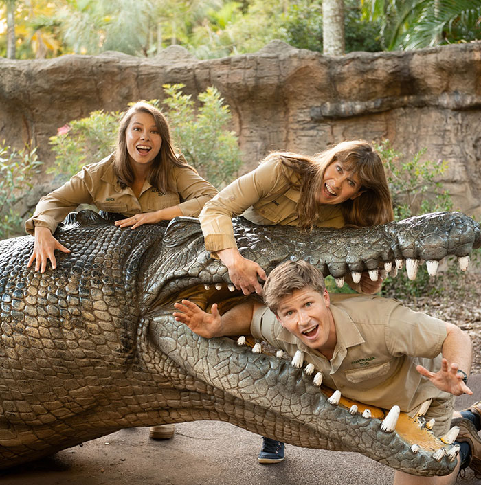 Bindi Irwin and team at Australia Zoo with a large crocodile statue, highlighting her surprising decision to leave Australia. Bindi Irwin and team at Australia Zoo with a large crocodile statue, highlighting her surprising decision to leave Australia.