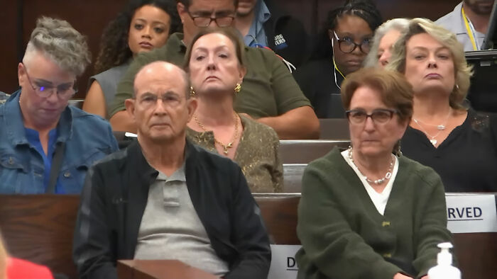 Juror listening intently during courtroom session about grandma's court meltdown and viral plot case.