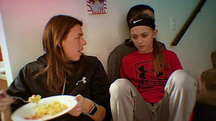 Mother and daughter sit indoors wearing sportswear, as prosecutor explains alleged secret torment over a year.