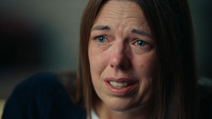 Woman with tears in her eyes explaining case details as prosecutor discusses mom secretly tormenting daughter over a year