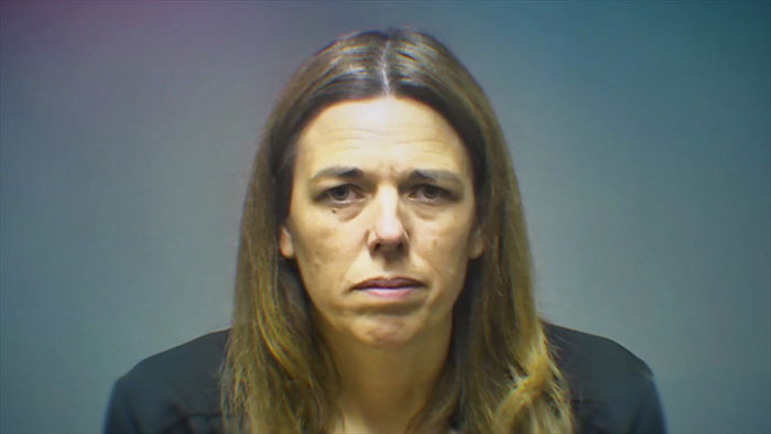 Mugshot of a woman accused of secretly tormenting her daughter, highlighting prosecutor&rsquo;s case details.