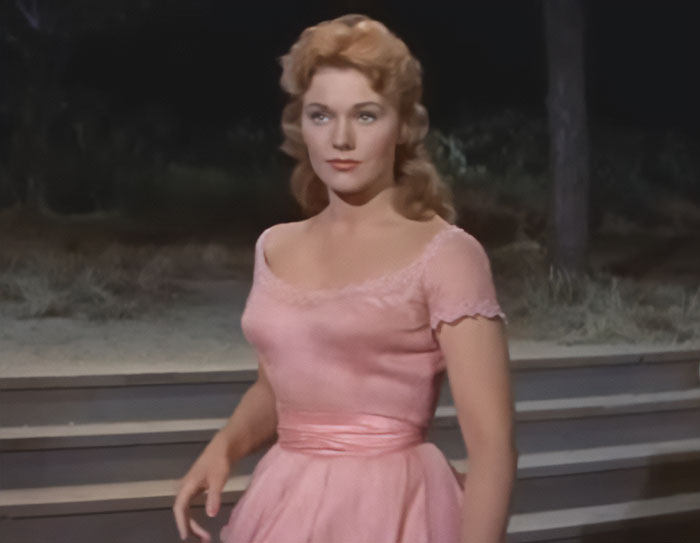 Kim Novak in a pink dress appearing unrecognizable while receiving a lifetime achievement award at Venice Film Festival