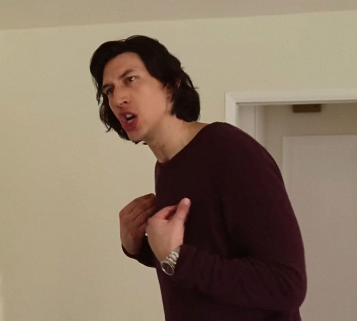 Person gesturing indoors, expressing strong emotions in a casual setting for people who knew celebrities before fame.